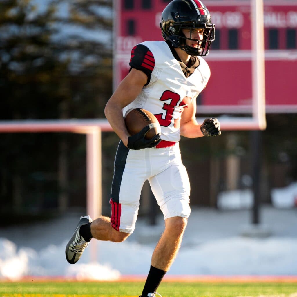 stacked american football uniforms durable athletic fabric