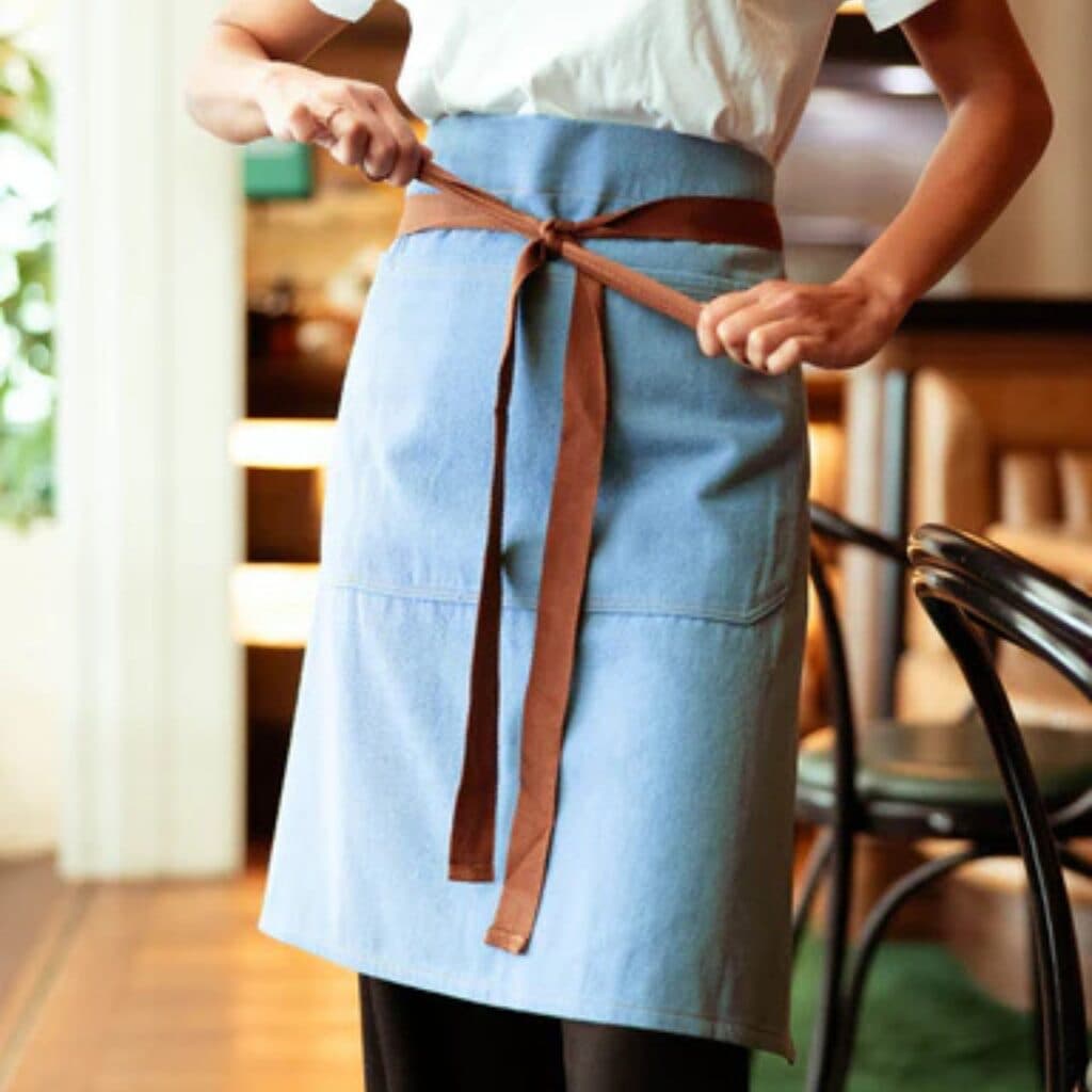 Bulk restaurant merch manufacturer for branded tees and aprons