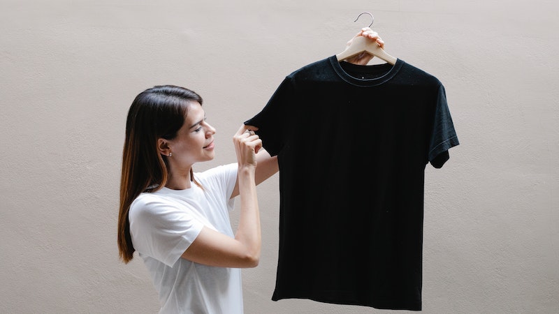 girl holding black t shirt